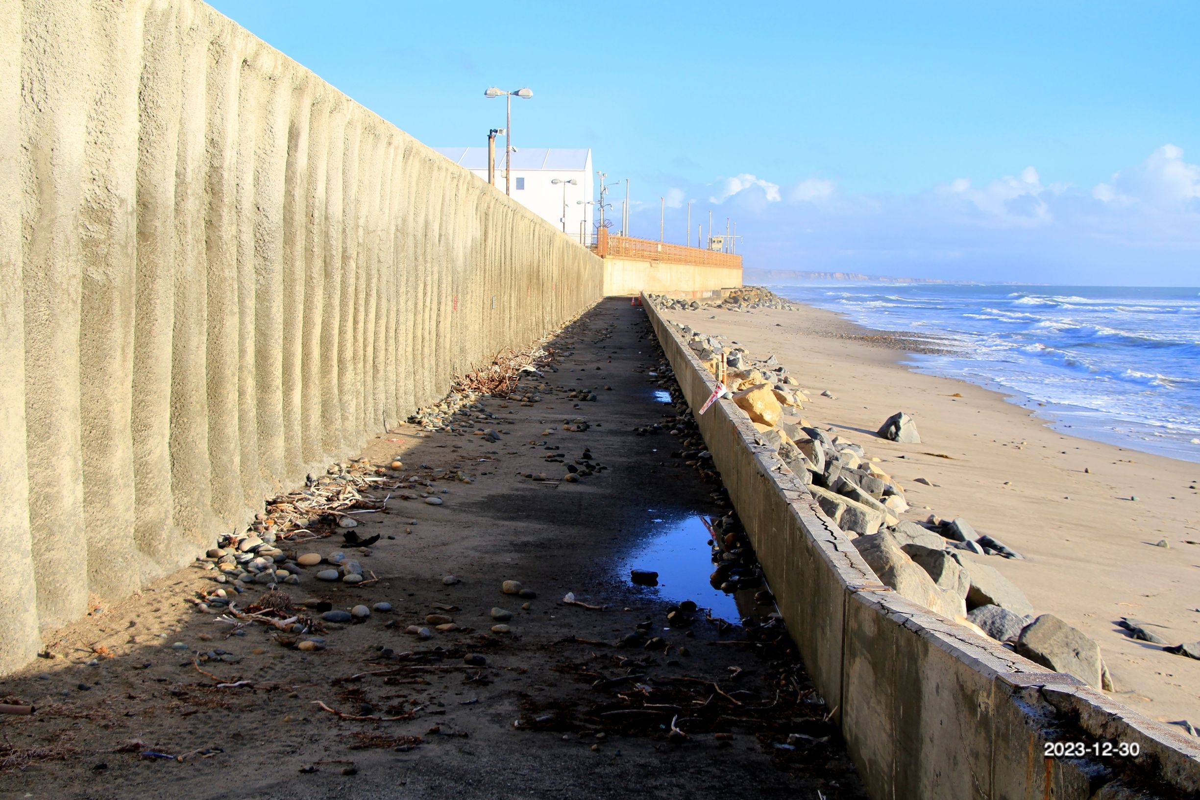 Damaged front seawall of SONGS at low tide