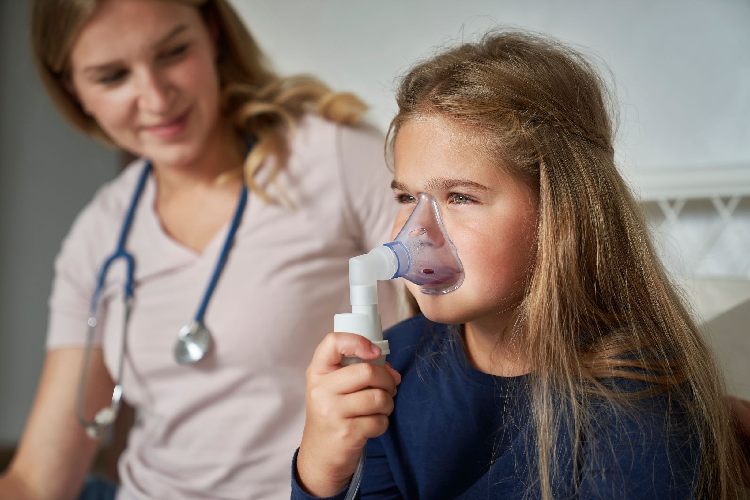 Child Receiving Nebulizer Treatment at Home