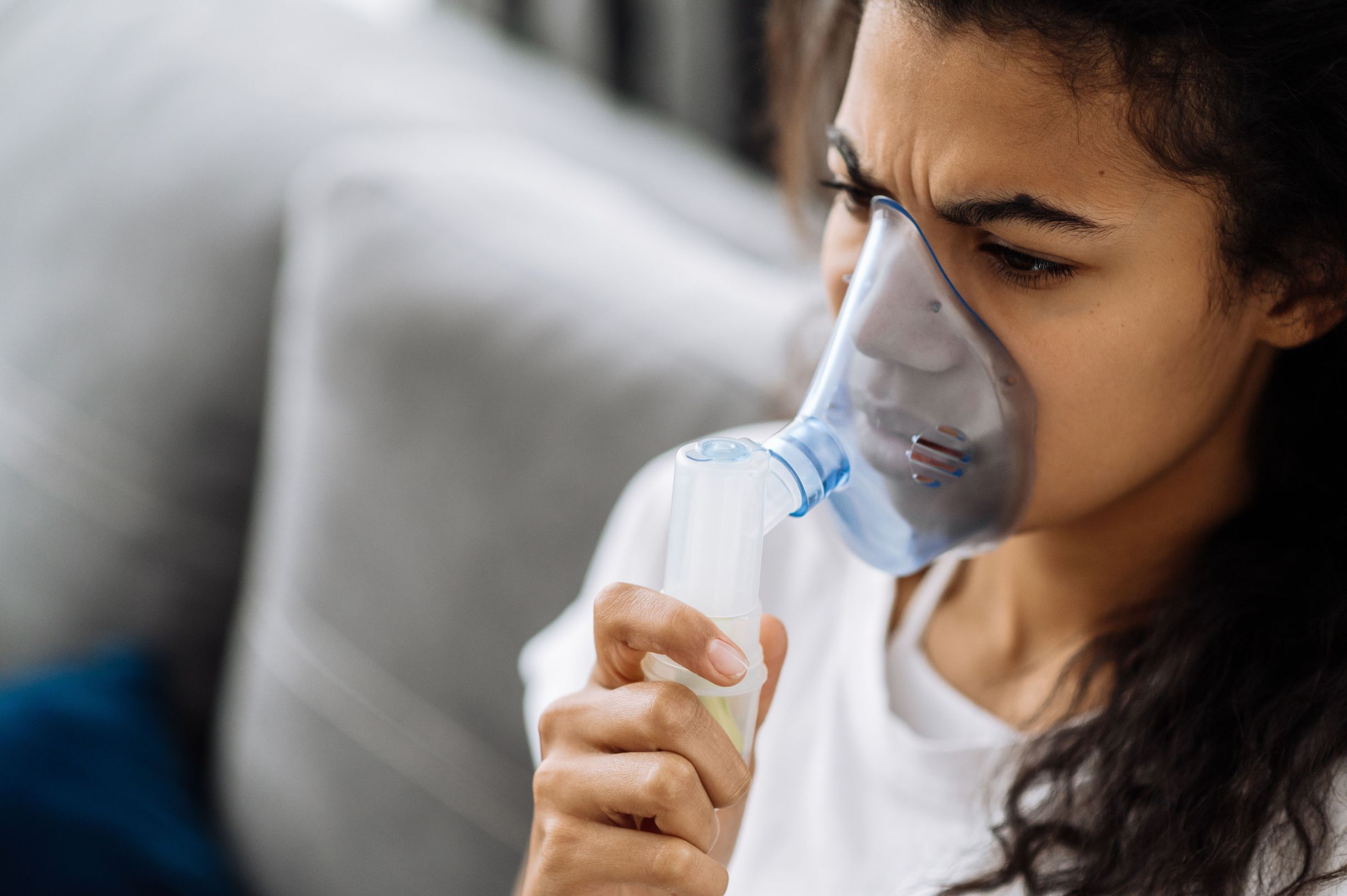 Young Woman Managing Sudden Asthma Attack