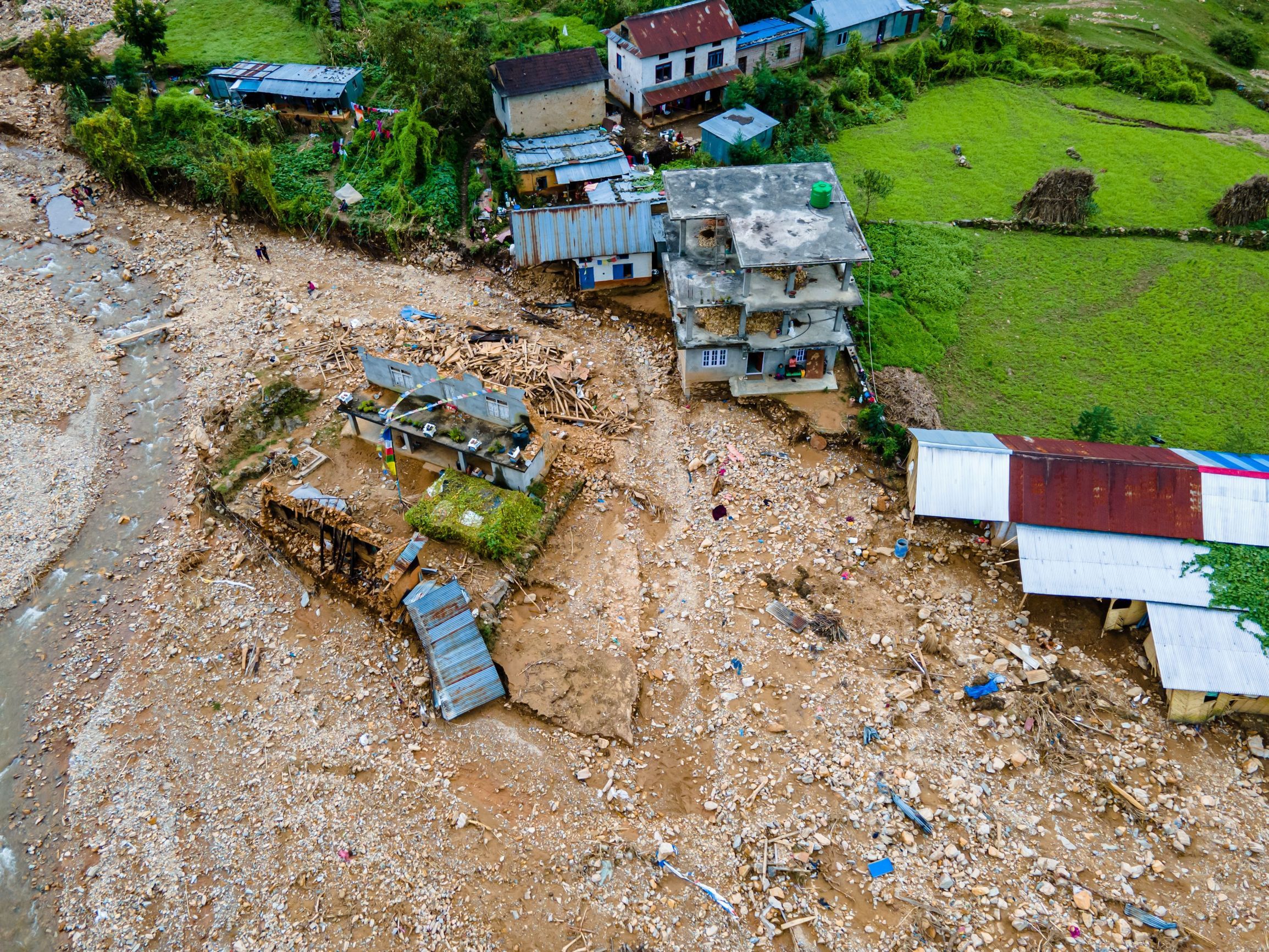 An aerial view showing flood-affected areas of a small town.